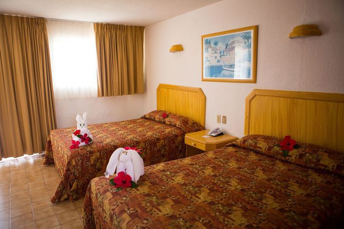 Hotel Qualton Ixtapa Zihuatanejo. Habitaciones del Hotel Qualton Ixtapa Zihuatanejo. Paquetes del Hotel Qualton Ixtapa Zihuatanejo. Ofertas del Hotel Qualton Ixtapa Zihuatanejo. Promociones del Hotel Qualton Ixtapa Zihuatanejo. Tarifas Hotel Qualton Ixtapa Zihuatanejo. Todo Incluido en el Hotel Qualton Ixtapa Zihuatanejo